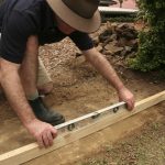 GardenDrum CStewart 2gabion wall checking the pad is level