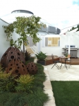 Padstow's cor-ten steel sculptures nestle down amid dwarf nandina and ground-covering casuarina