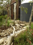 How to make a backyard a sustainable joy - water tanks, a creek, native vegetation and Phillip Johnson as your designer