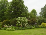 GardenDrum BFeistel 13- the other side-end in May 2012, a mirror of the the new colour scheme but brightened with Lily & Euphorbia