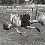 kid on clothesline