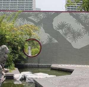 Circular window draws eye down away from overlooking buildings