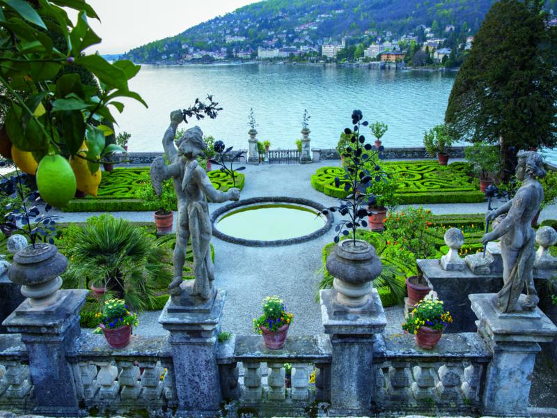 Isola Bella, Lake Maggiore. 'Gardens of the Italian Lakes' by Steven Desmond, photography by Marianne Majerus, p32-33. “From the platform on top of the pyramid, a sudden view opens down over the terraces to the parterre below. In the foreground, delicate ornaments of wrought iron in many forms are held aloft. Across the bay is the town of Stresa.” 